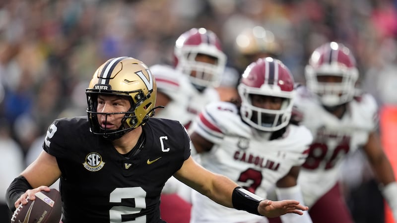 Vanderbilt quarterback Diego Pavia (2) runs the ball during the first half of an NCAA college...