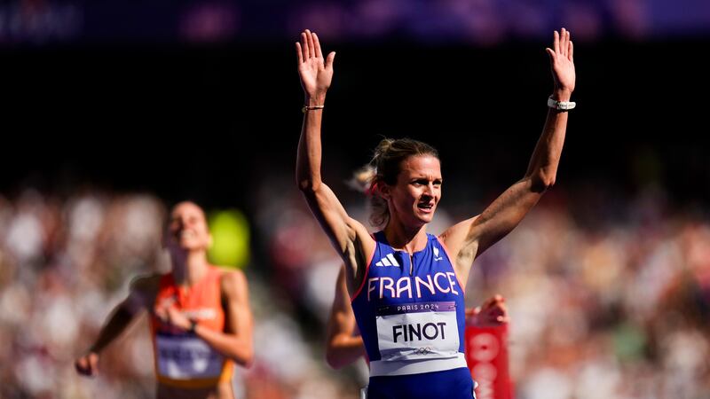 Alice Finot, of France, reacts after a heat in the women's 3000-meter steeplechase at the 2024...