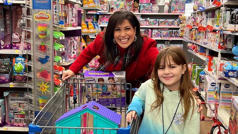 Holly Thompson with 9-year-old Ashley during the Christmas 4 Kids holiday shopping spree.