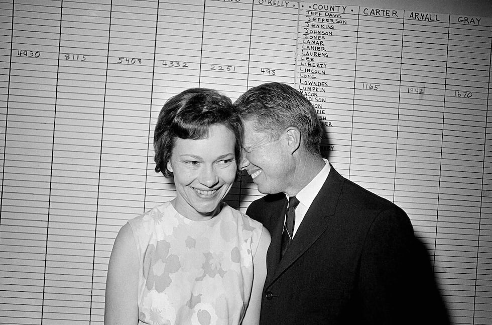 FILE - Georgia State Sen. Jimmy Carter hugs his wife, Rosalynn, at his Atlanta campaign...