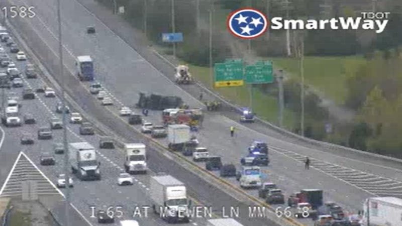 Several lanes blocked on I-65 by overturned semi-truck