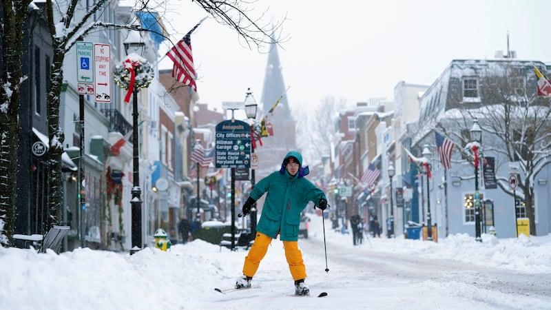 FILE - Cosimos Cendo, of Washington, D.C., skis down Main Street in Annapolis, Md., Monday,...