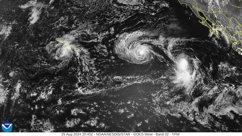 Satellite imagery shows hurricanes Hone and Gilma and Tropical Storm Hector in the central and...