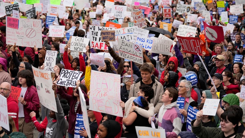 Students protest gun violence in schools at the legislative plaza and state Capitol Monday,...