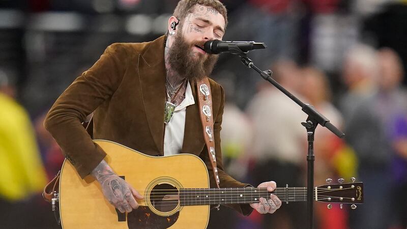 Post Malone performs "America the Beautiful" during the first half of the NFL Super Bowl 58...