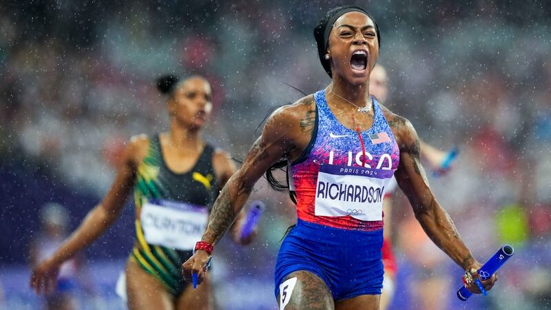 Sha'carri Richardson 0f the United States, celebrates after winning the women's 4 x 400-meter...