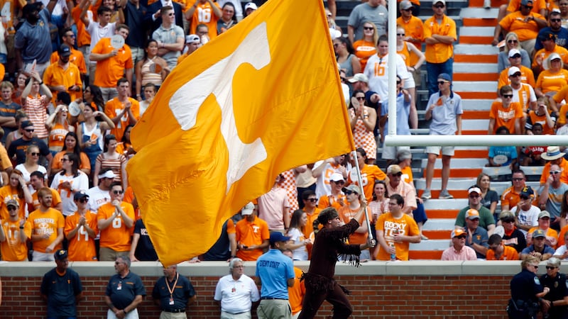 The Tennessee mascot runs across the end zone with a flag after a score in the first half of...