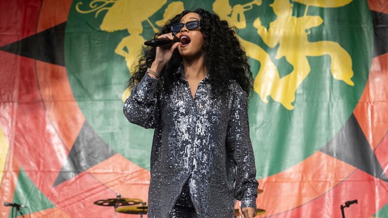 FILE - H.E.R. performs at the 2023 New Orleans Jazz & Heritage Festival on May 6, 2023.