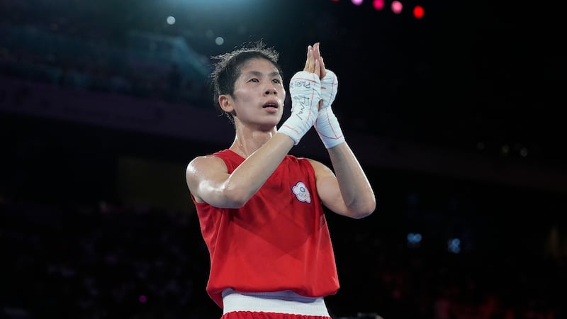 Taiwan's Lin Yu-ting celebrates after defeating Poland's Julia Szeremeta in their women's 57...