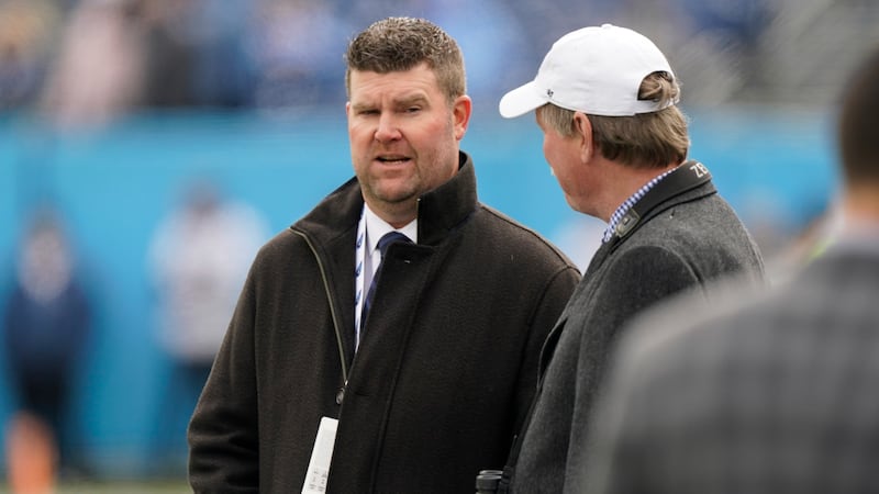 Tennessee Titans general manager Jon Robinson walks on the turf before an NFL football game...