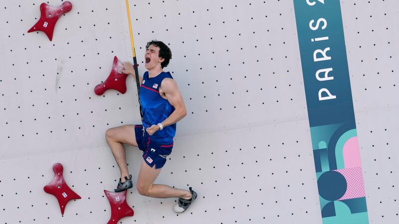 Sam Watson of the United States reacts as he competes in the men's speed, qualification...