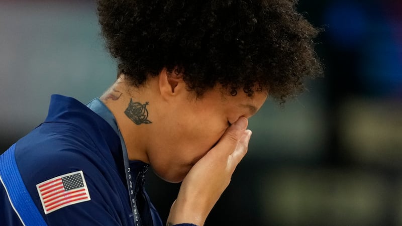 United States' Brittney Griner wipes a tear after a women's gold medal basketball game at...