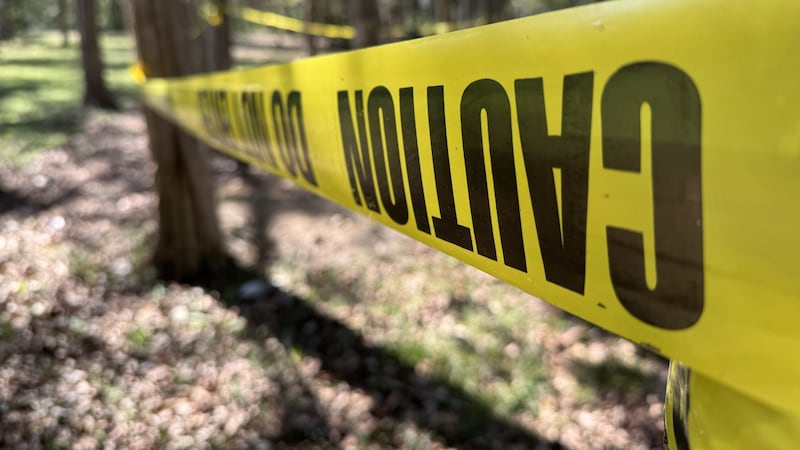 Crime Scene tape surrounds tables near 
Percy Priest Lake.