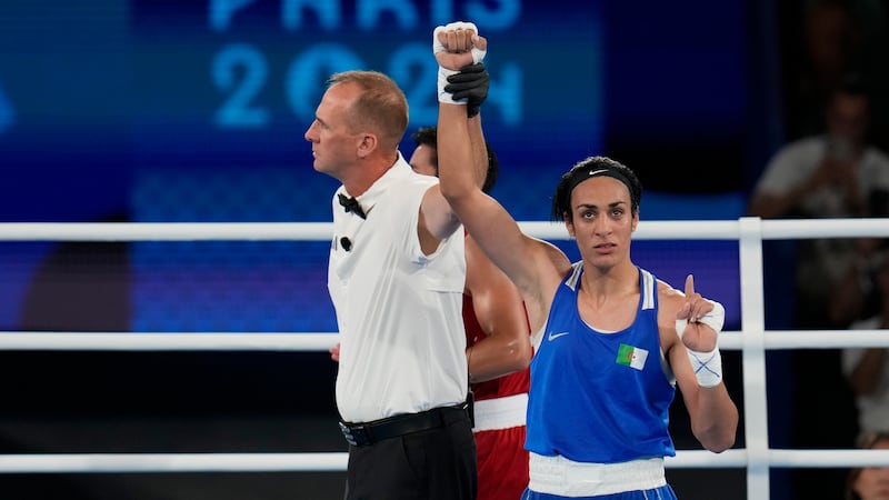 Algeria's Imane Khelif gestures after defeating Thailand's Janjaem Suwannapheng in their...