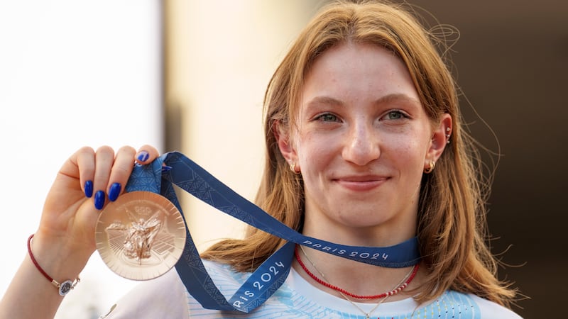 Romanian gymnast Ana Barbosu poses with the bronze medal for her women's artistic gymnastics...