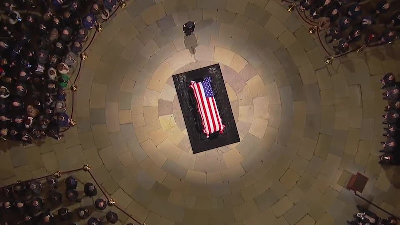 The casket of the 39th President of the United States Jimmy Carter lies under the dome of the...