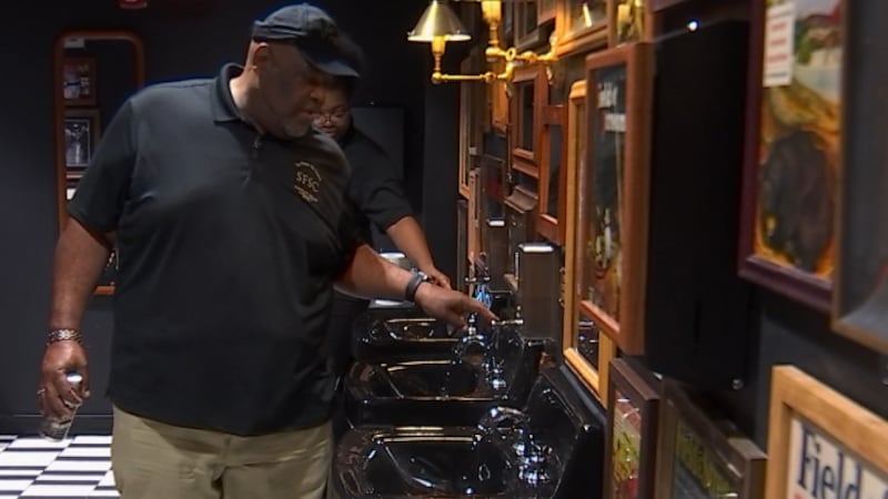 Alonzo Cheeks checks sinks at Chief's on Broadway as part of his role as a restroom manager.