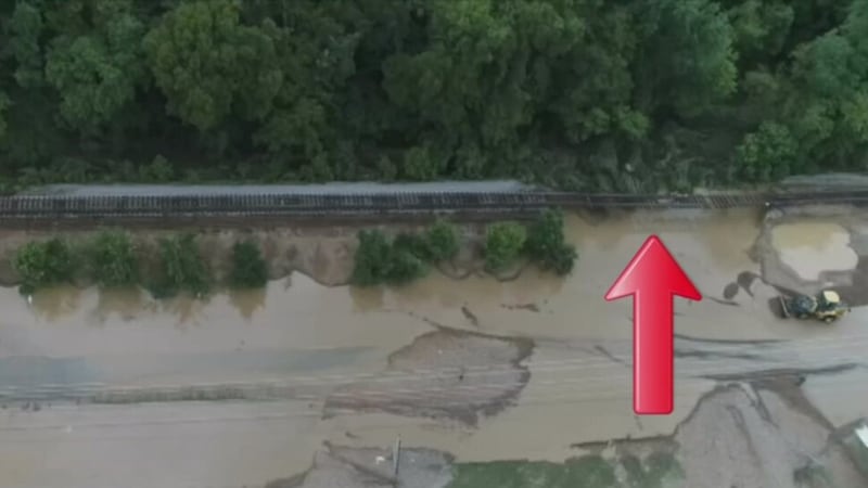 Arrows mark the locations where floodwaters washed out the CSX railroad line in Waverly on...