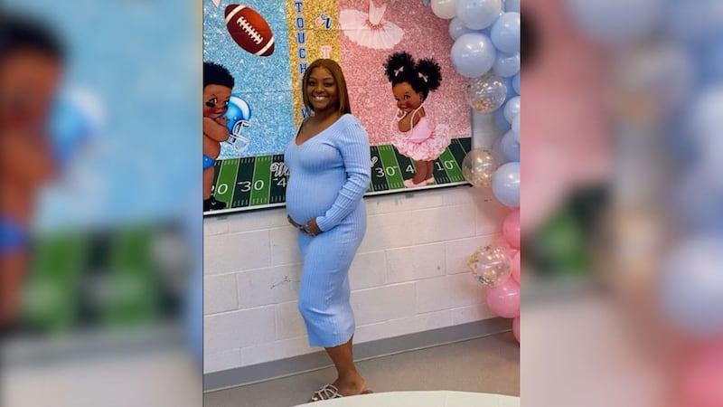 A pregnant Tyesha Kinnard poses for a photo just weeks before the abrupt end of her pregnancy...