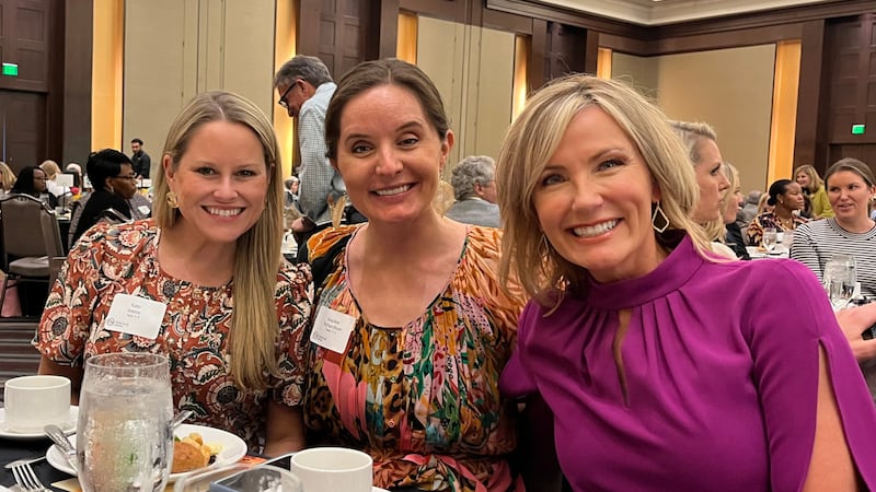 Tracy Kornet, right, hosted Renewal House's annual Thanksgiving luncheon on Tuesday.