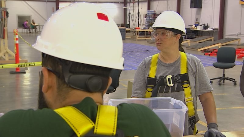 Sam Demonbreun, along with her classmates, learns the basics of solar installation at the...