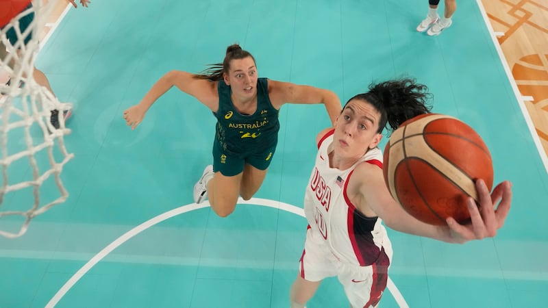 United States' Breanna Stewart (10) shoots past Isobel Borlase (20), of Australia, during a...