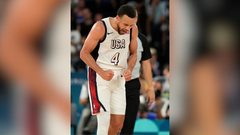 United States' Stephen Curry (4) celebrates a basket against Serbia during a men's semifinals...